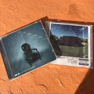 Wiz Khalifa and Kendrick Lamar CDs